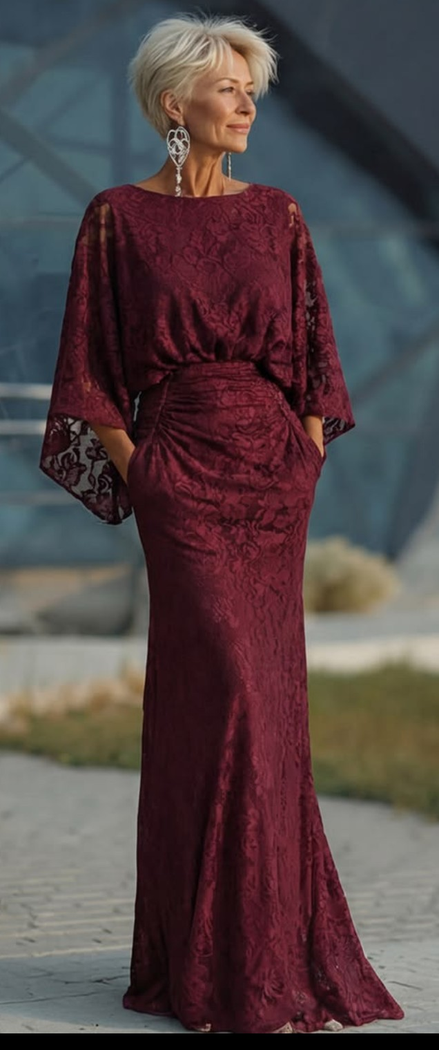 Burgundy lace gown with cape sleeves